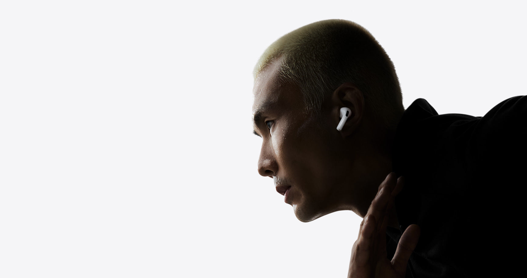A runner wearing AirPods Pro 3